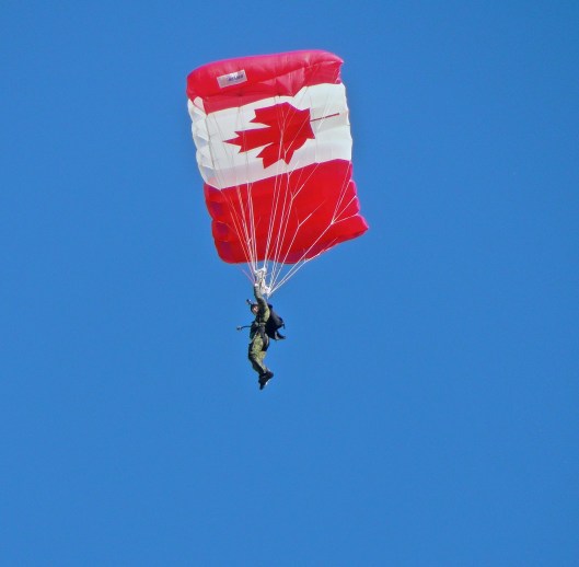 The half-time show at the Labour Day Classic between the Saskatchewan Roughriders and the Winnipeg Blue Bombers was parachutists from 15 Wing Moose Jaw competing to see who could land on target at mid-field.  I thought they looked liked little miniature army men falling from the sky 